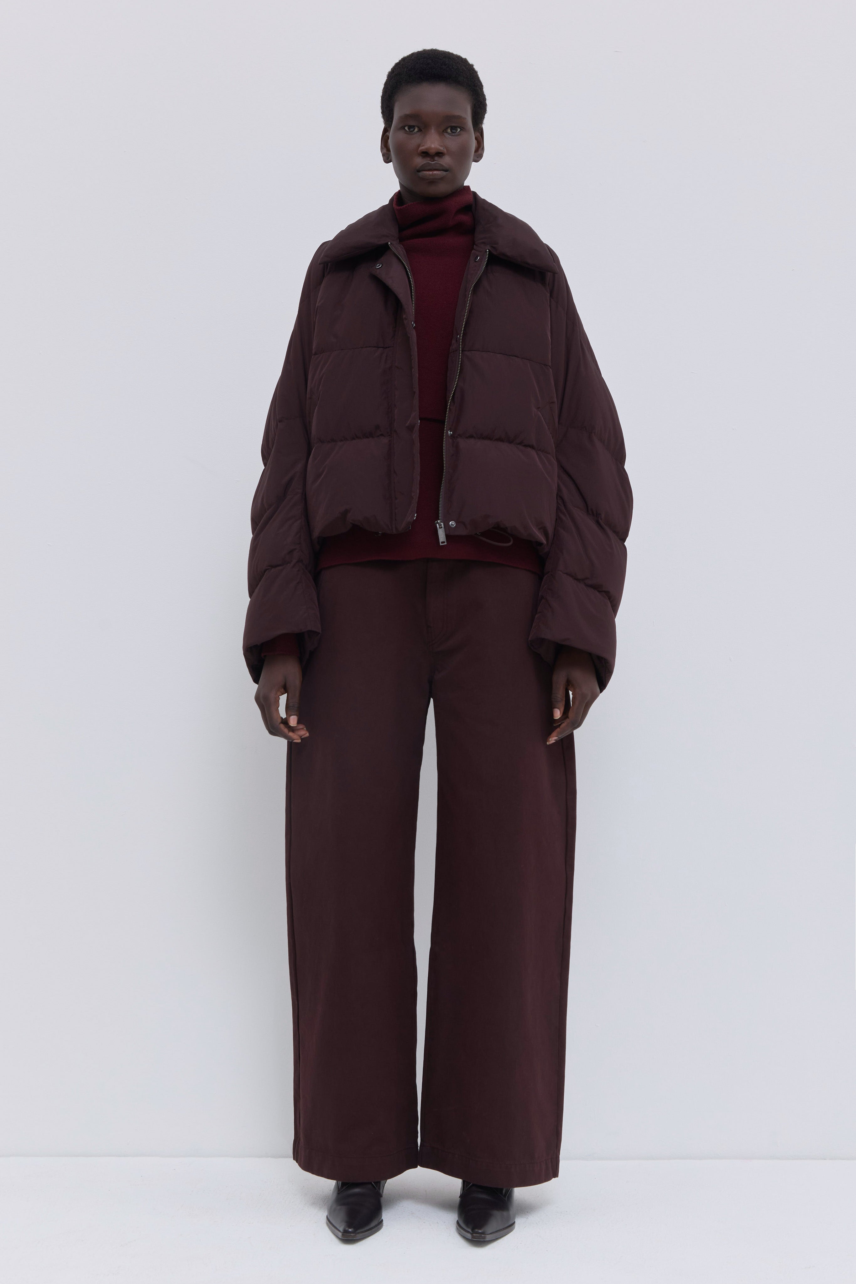 Jani cropped down jacket in plum soft water-repellent nylon.