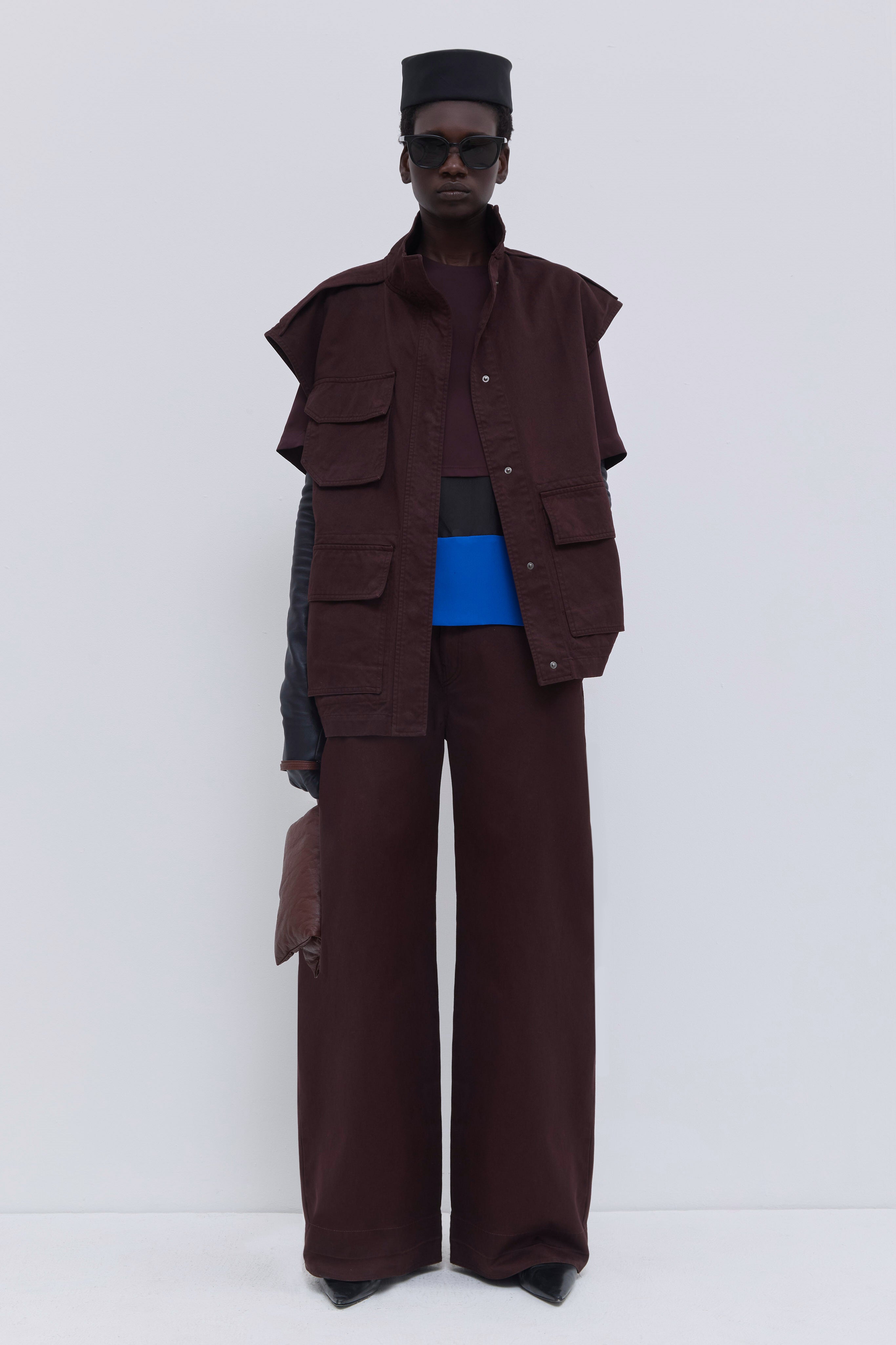 Christian Wijnants Jupi sleeveless jacket in plum garment-dyed organic cotton with utility pockets and high collar.
