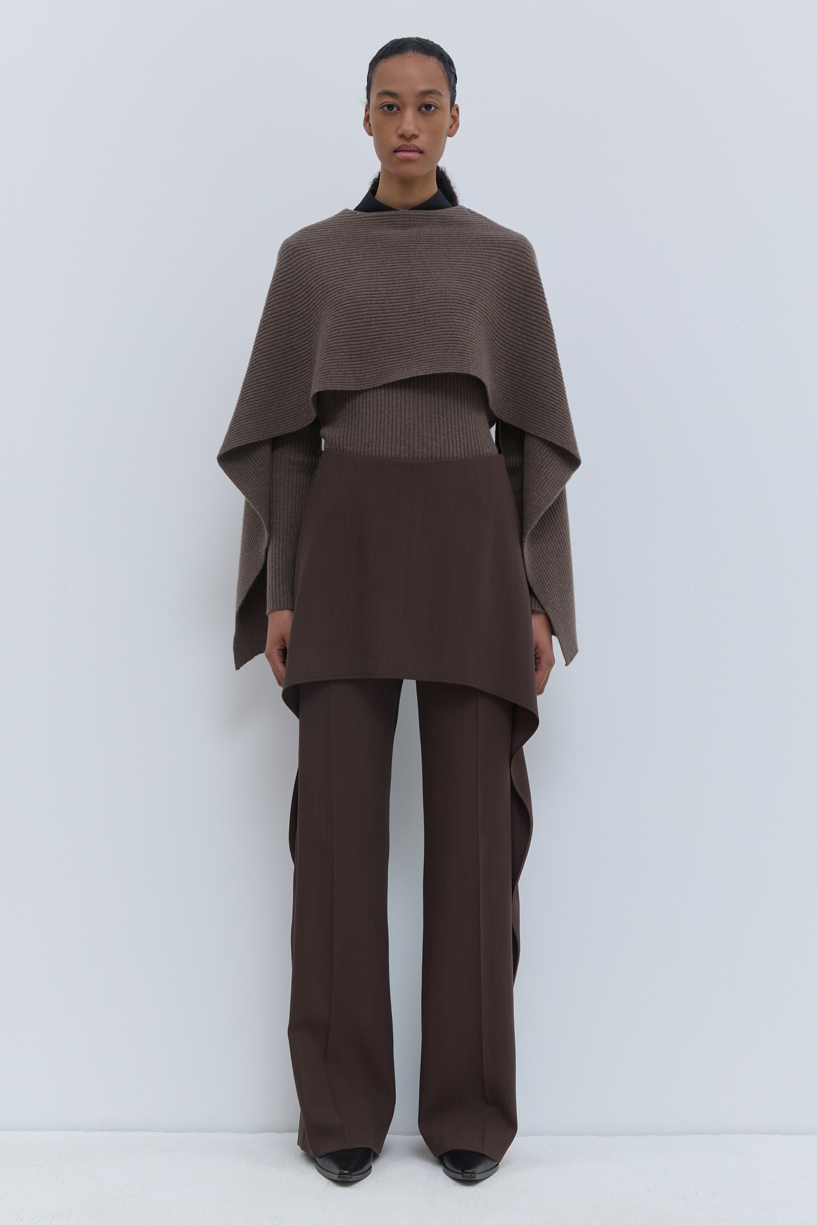 Christian Wijnants Pilba chestnut virgin wool wide-leg trousers with layered skirt overlay, shown from the front