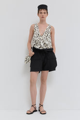 Smoke panthera V-neck top in quilted fabric with side panels front