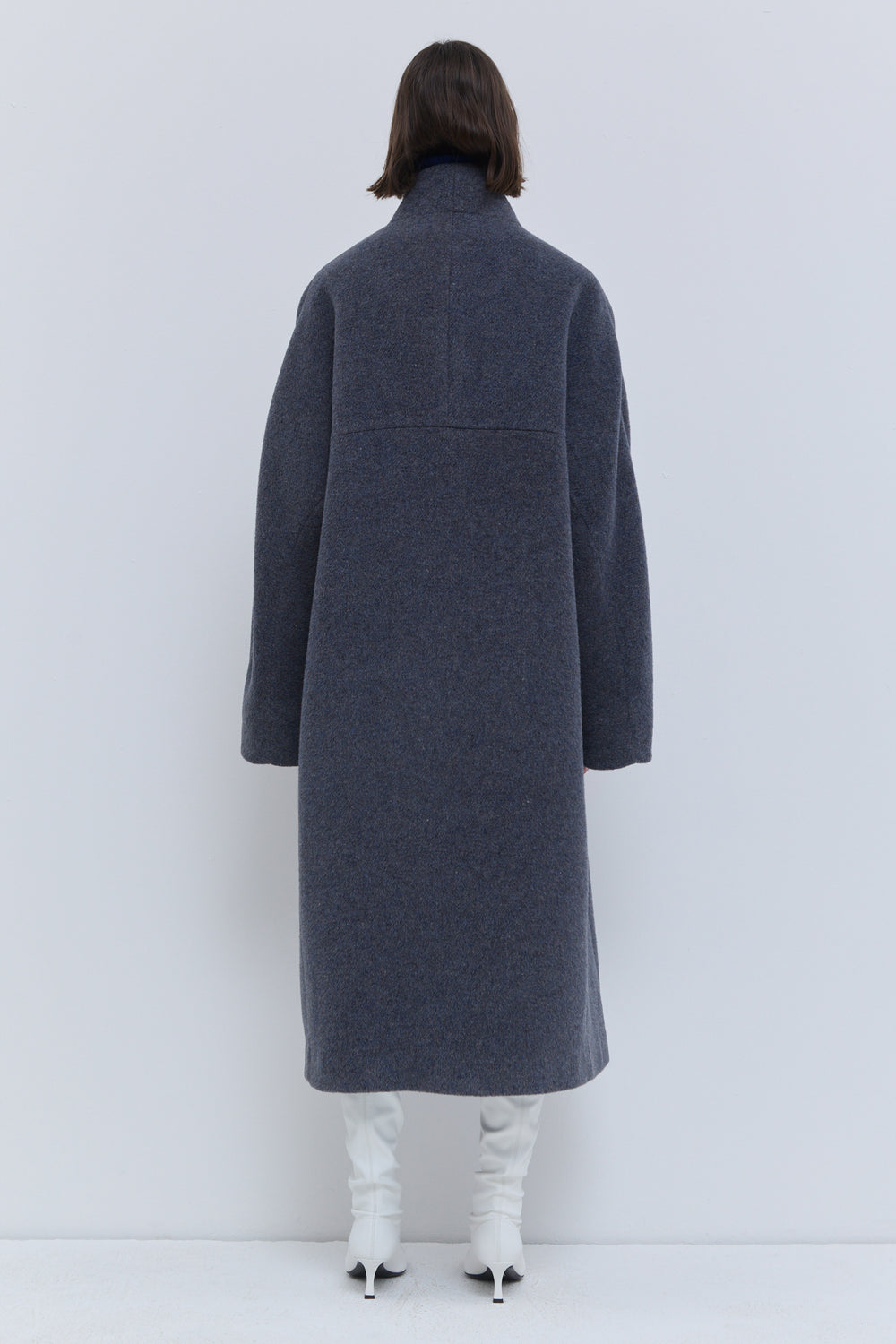 Front view of Caparis dust blue wool coat for women