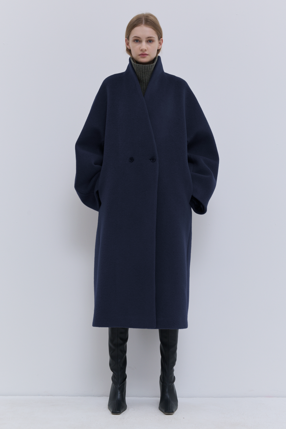 Luxury dark navy wool coat with rounded sleeves