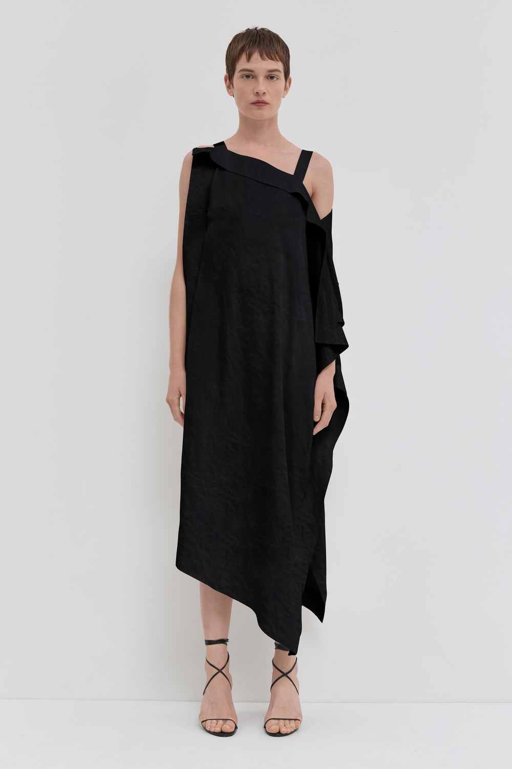 Black asymmetrical maxi dress in crushed viscose with open shoulder detail