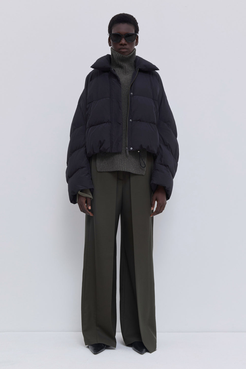 Jani cropped down jacket in black soft water-repellent nylon.