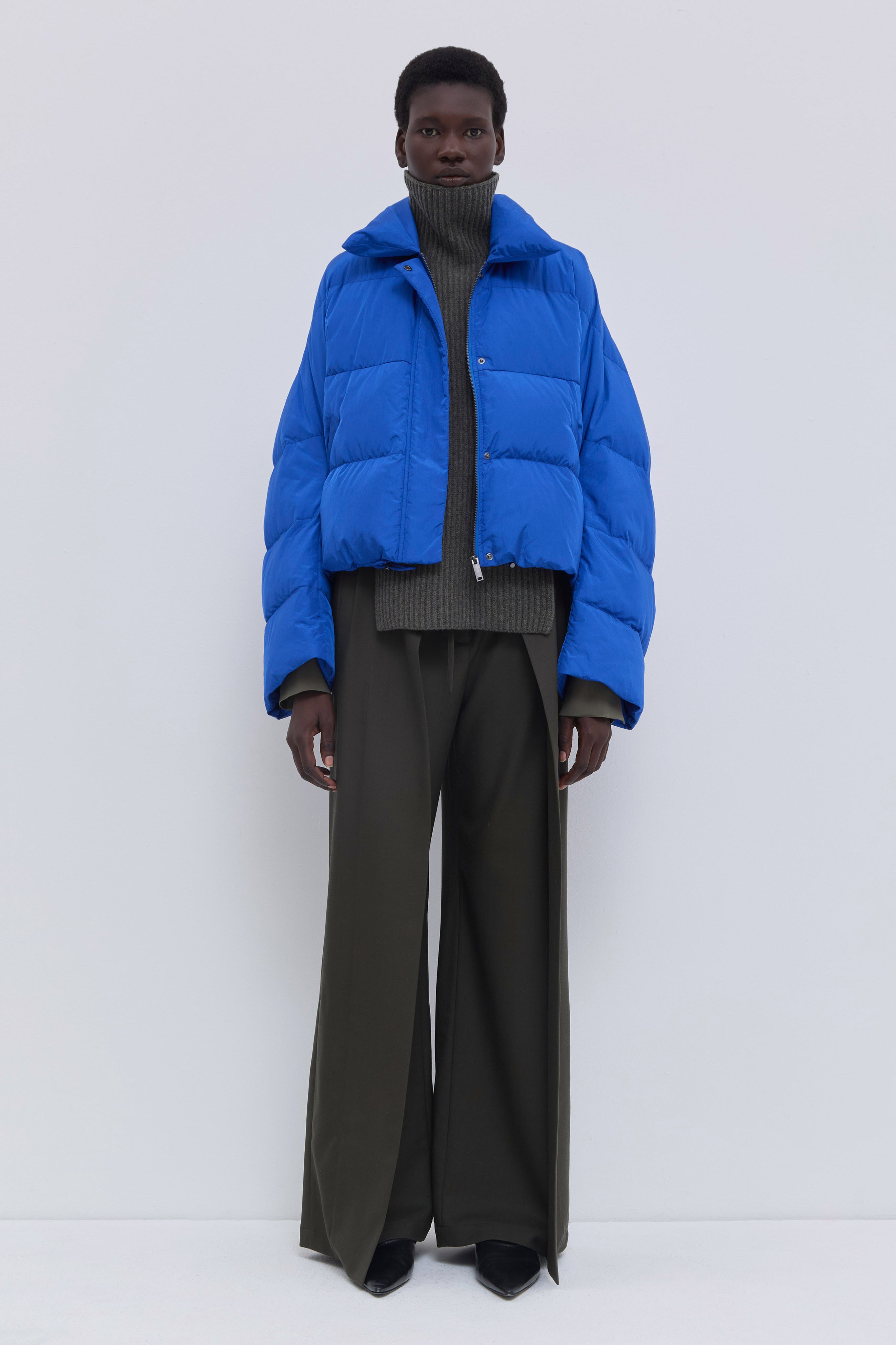 Jani cropped down jacket in cobalt soft water-repellent nylon.