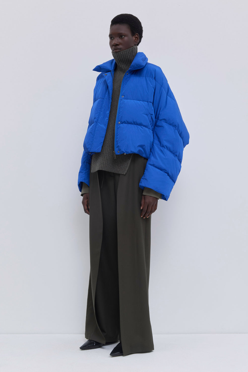 Front view of the Jani oversized down jacket with statement collar in cobalt.