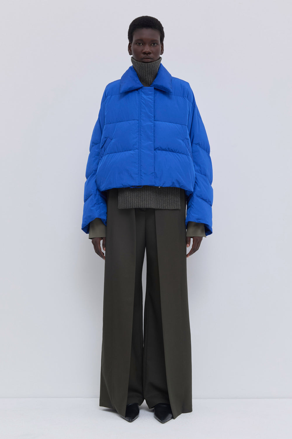 Front view of the Jani oversized down jacket with statement collar in cobalt.