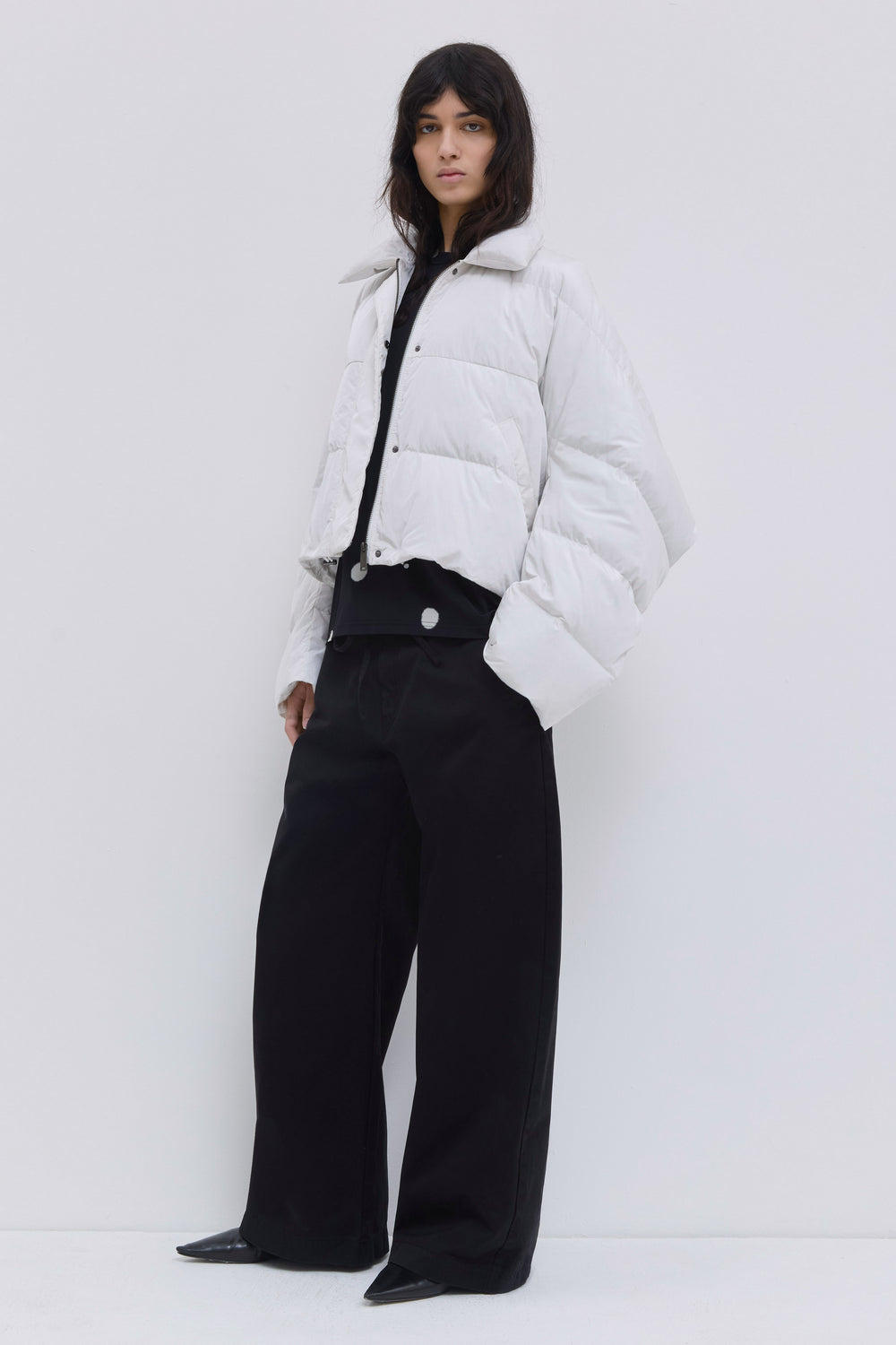 Front view of the Jani oversized down jacket with statement collar in off white.