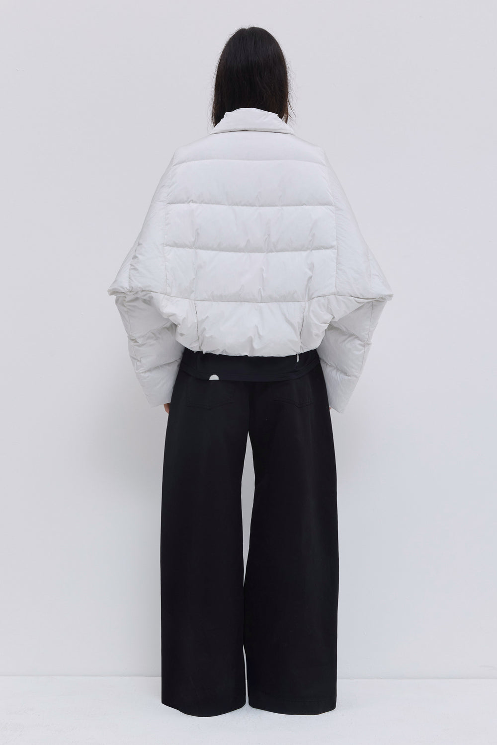 Back view of the Jani signature down jacket in off white.