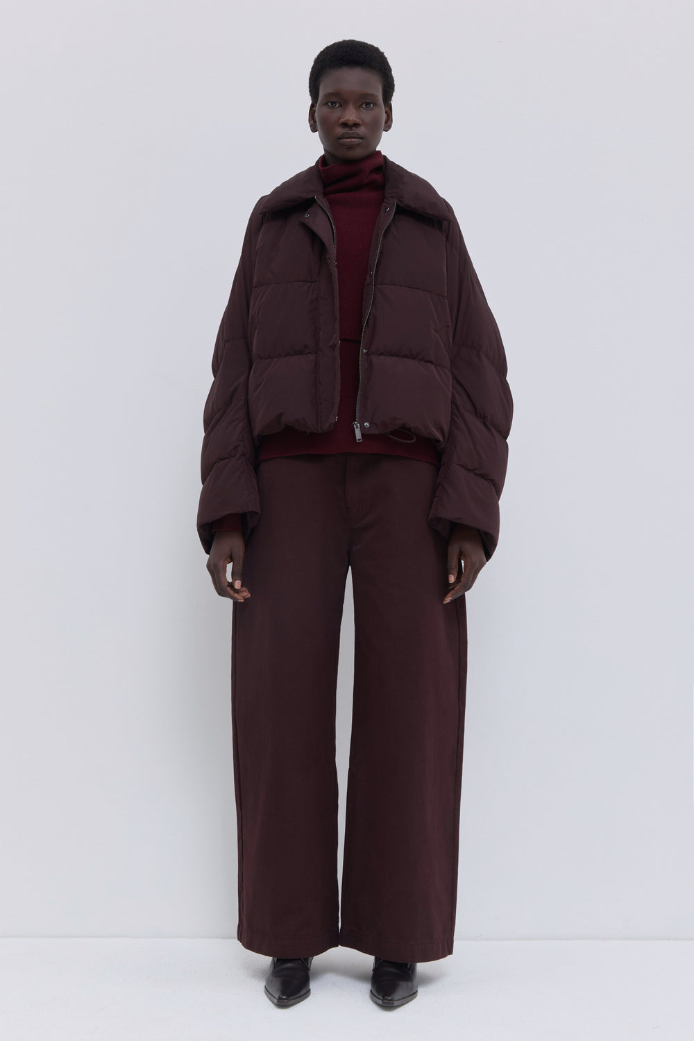 Jani cropped down jacket in plum soft water-repellent nylon.