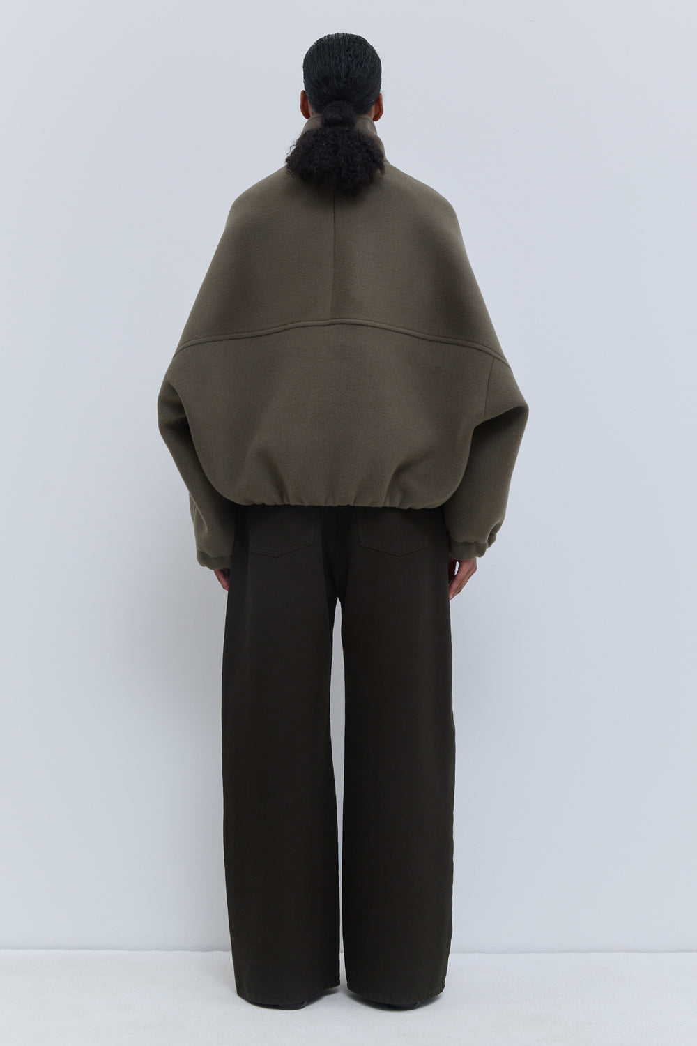 Christian Wijnants Japuto Laurel wool bomber jacket shown from the back with relaxed oversized silhouette