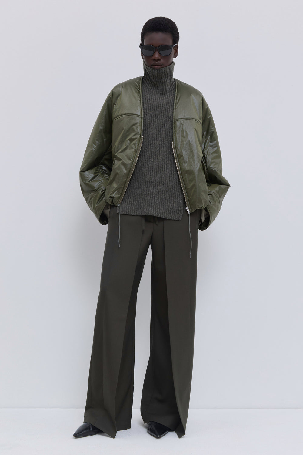 Front view of the Jelana lightweight padded jacket in olive.