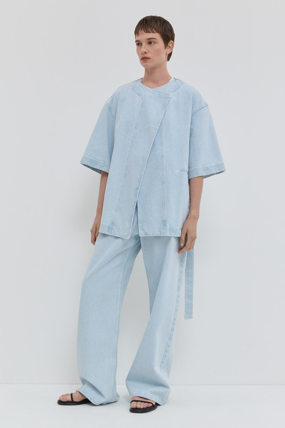 Light blue denim jacket with short kimono sleeves and relaxed fit