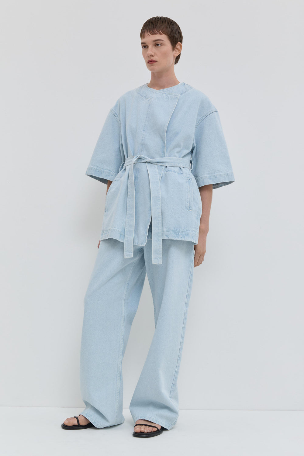 Light blue denim jacket with short kimono sleeves and relaxed fit