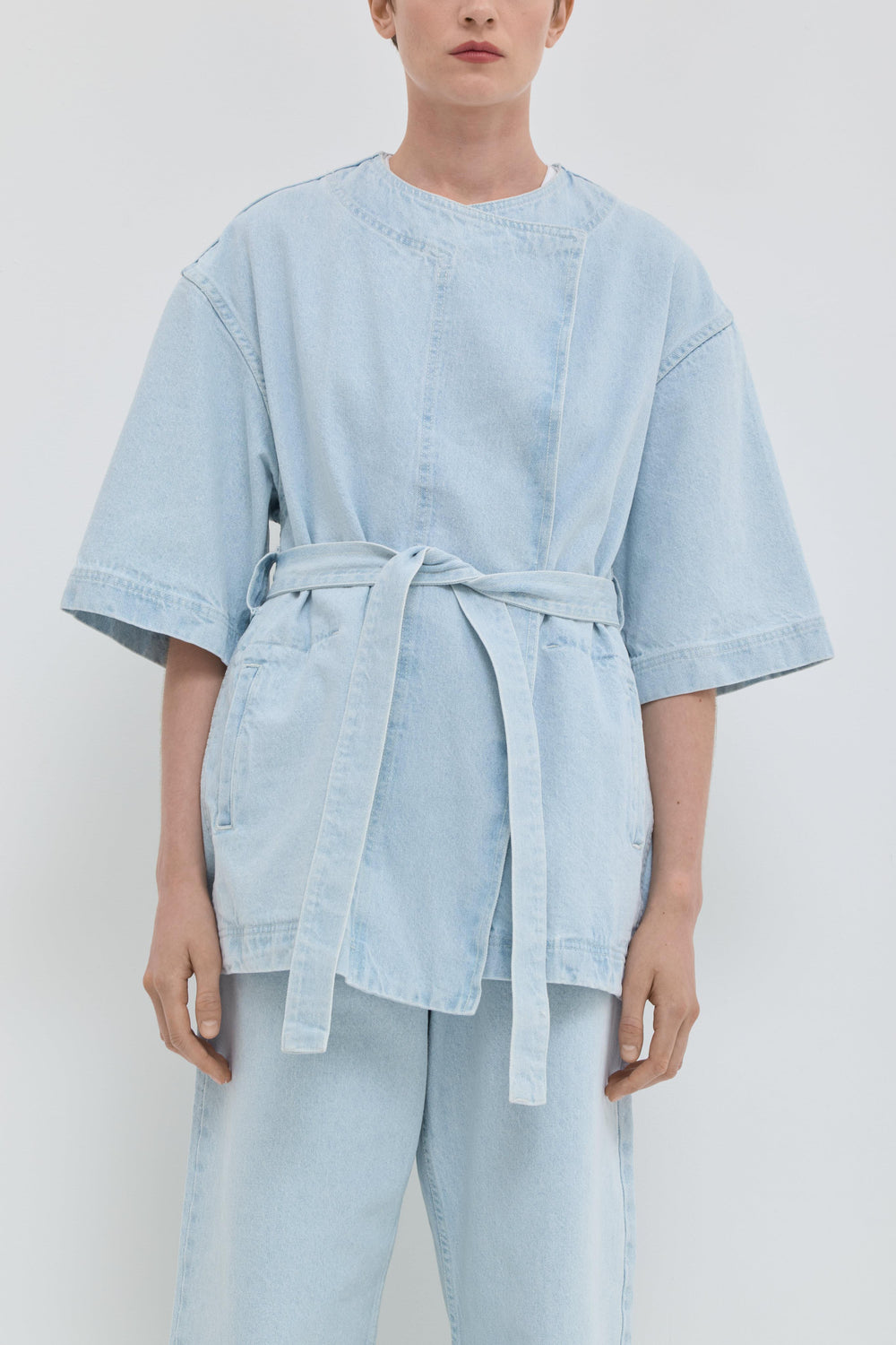 Light blue denim jacket with short kimono sleeves and relaxed fit