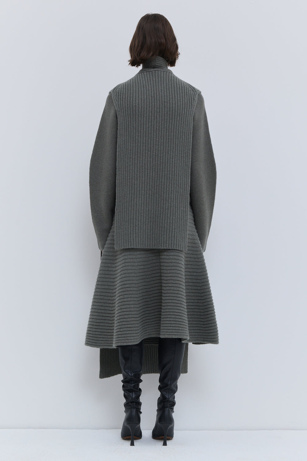 Christian Wijnants Kadija laurel melange ribbed scarf worn over a black outfit