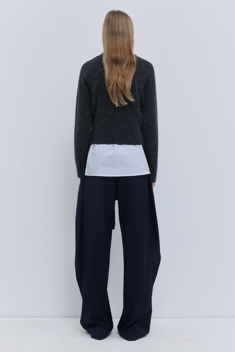Kadoka ribbed-knit sweater styled with navy wide-leg trousers
