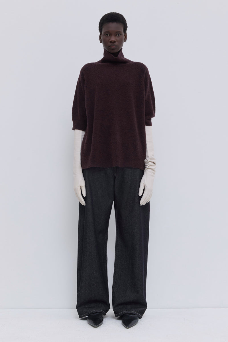 Deep plum bouclé turtleneck knit top with short sleeves and relaxed fit.