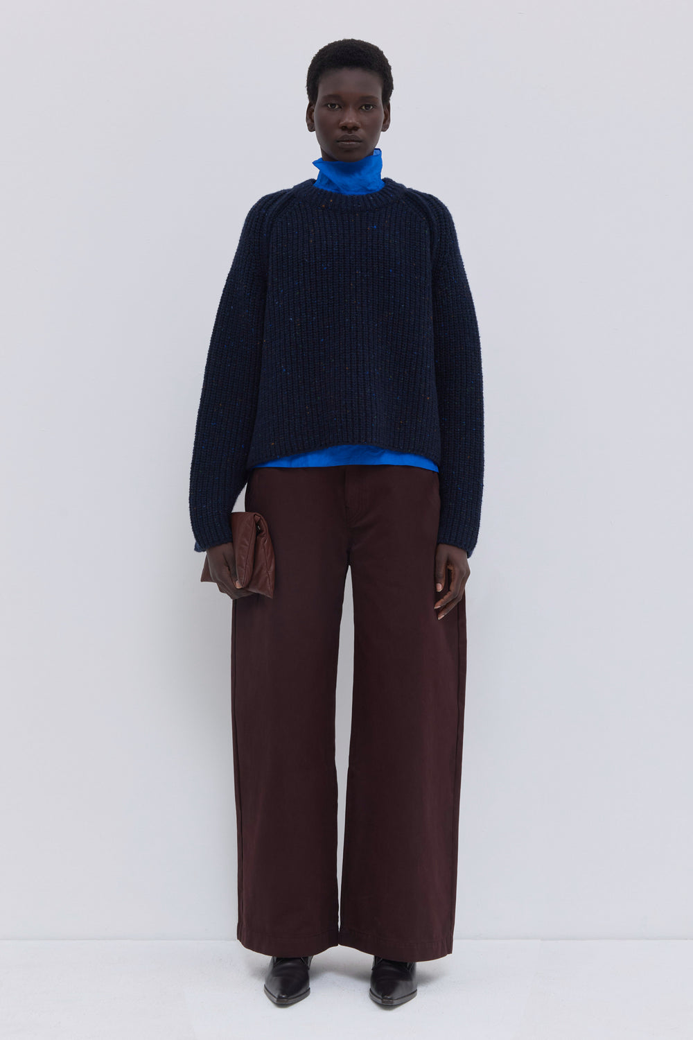 Women’s navy ribbed knit sweater crafted from an Italian cashmere blend with raglan sleeves.