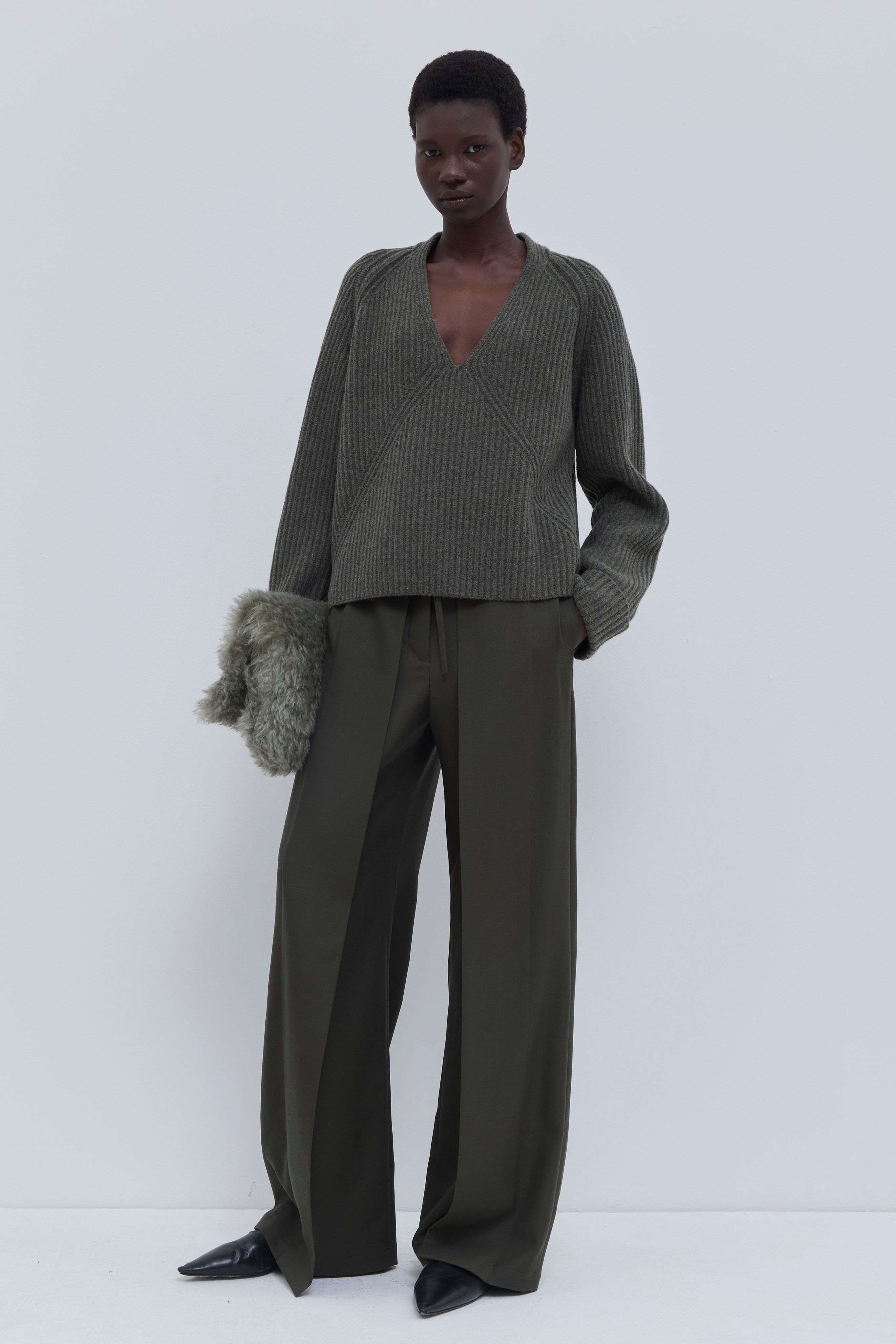 Forest melange ribbed merino wool and cashmere V-neck sweater front packshot.