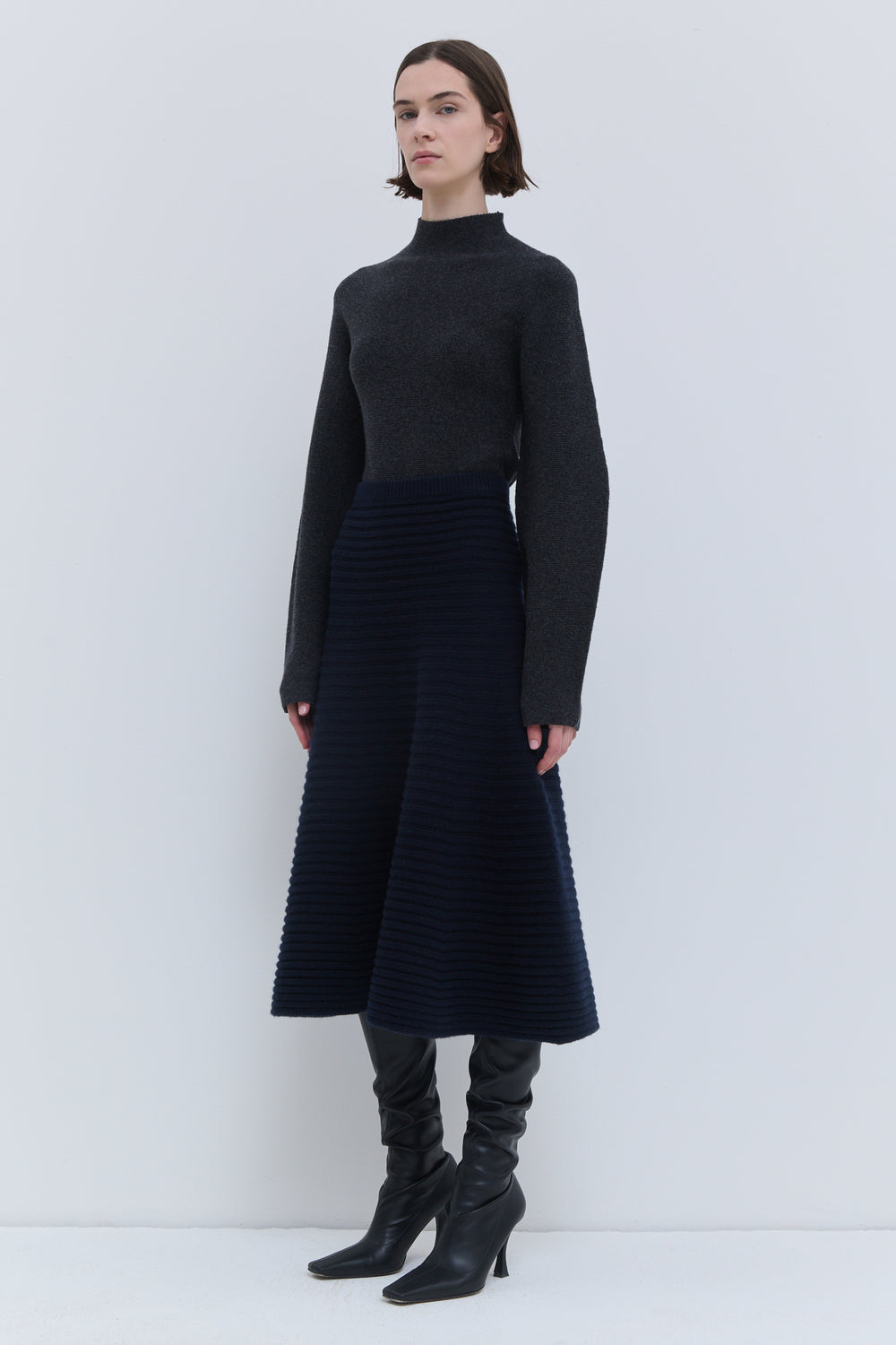 Dark marine 3D ribbed knit skirt with flared silhouette