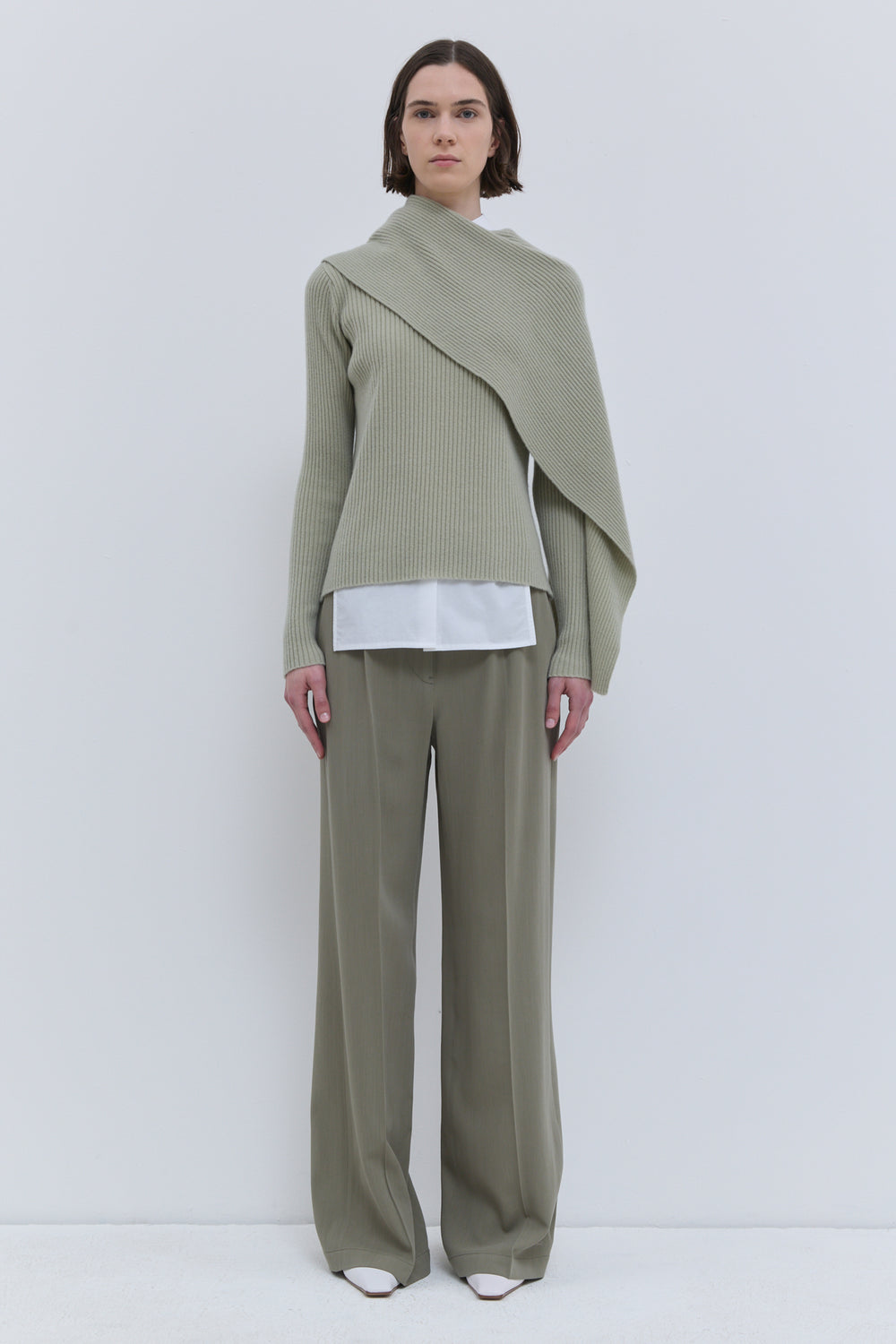 Light sage knit sweater with draped detachable scarf