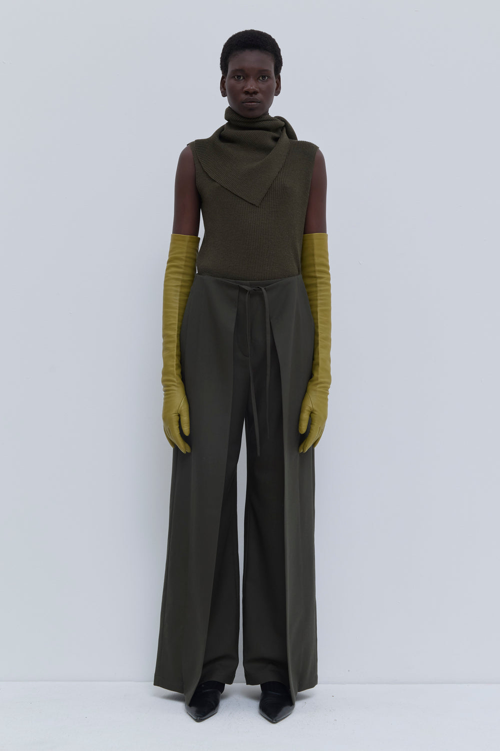 Front view of the Paire wide-leg trousers in Deep Forest with deep pleats and waist cord detail.