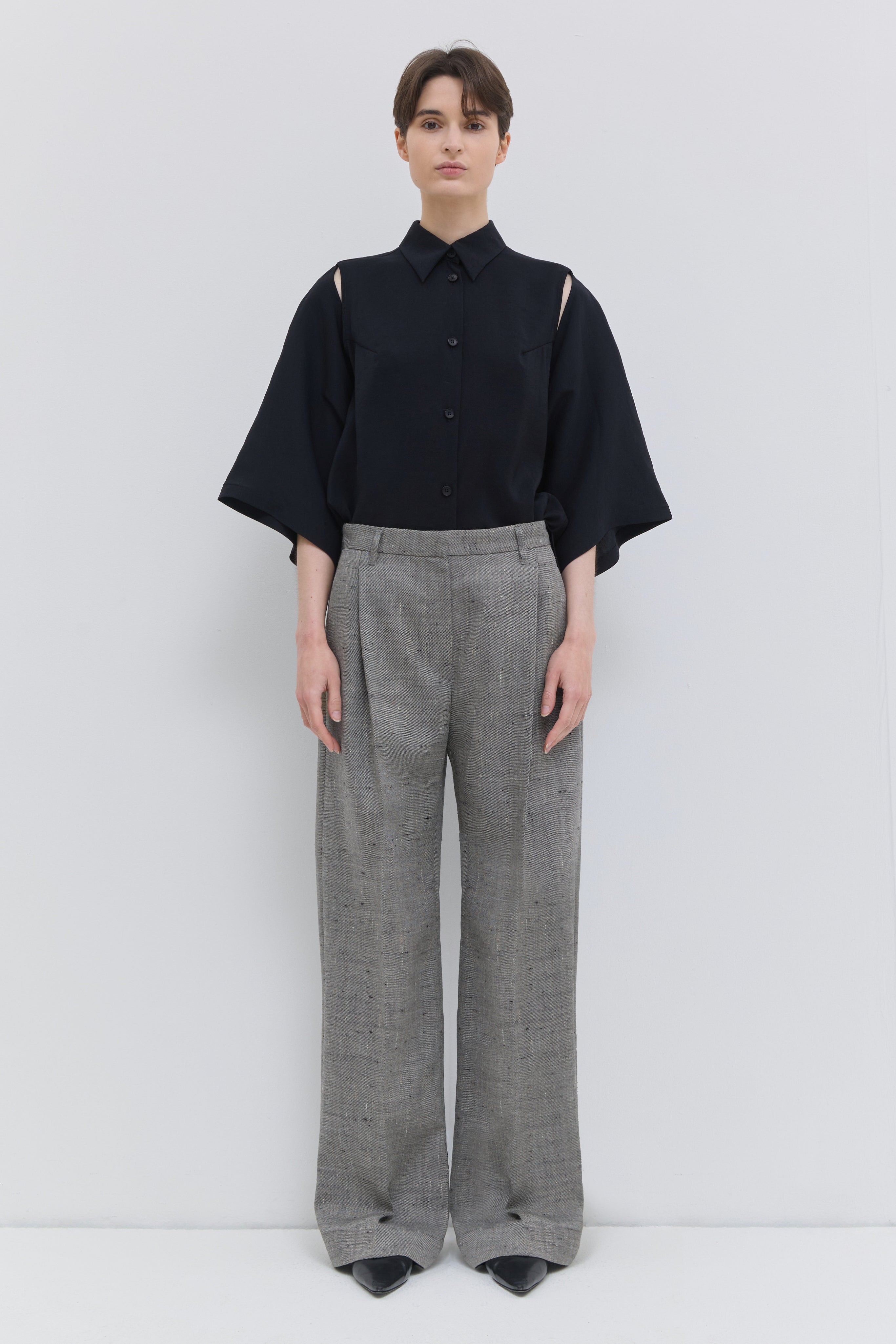 Front view of the Pama classic trousers in oat chartreux with wide legs and pressed front crease.