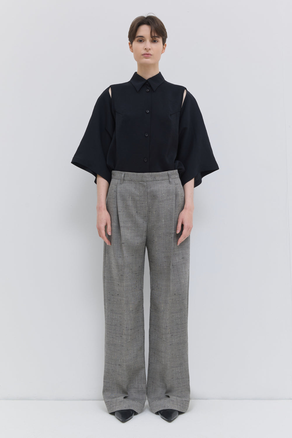 Front view of the Pama classic trousers in oat chartreux with wide legs and pressed front crease.
