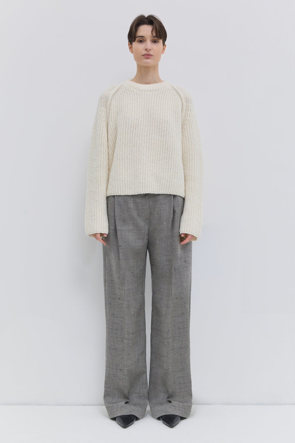 Front view of the Pama classic virgin wool trousers in oat chartreux with a wide-leg silhouette.