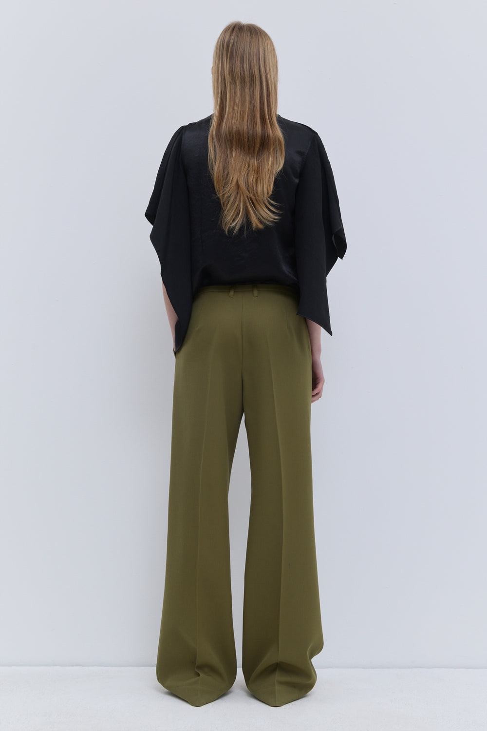 Christian Wijnants Pamira olive green wide-leg trousers in 100% virgin wool, back view