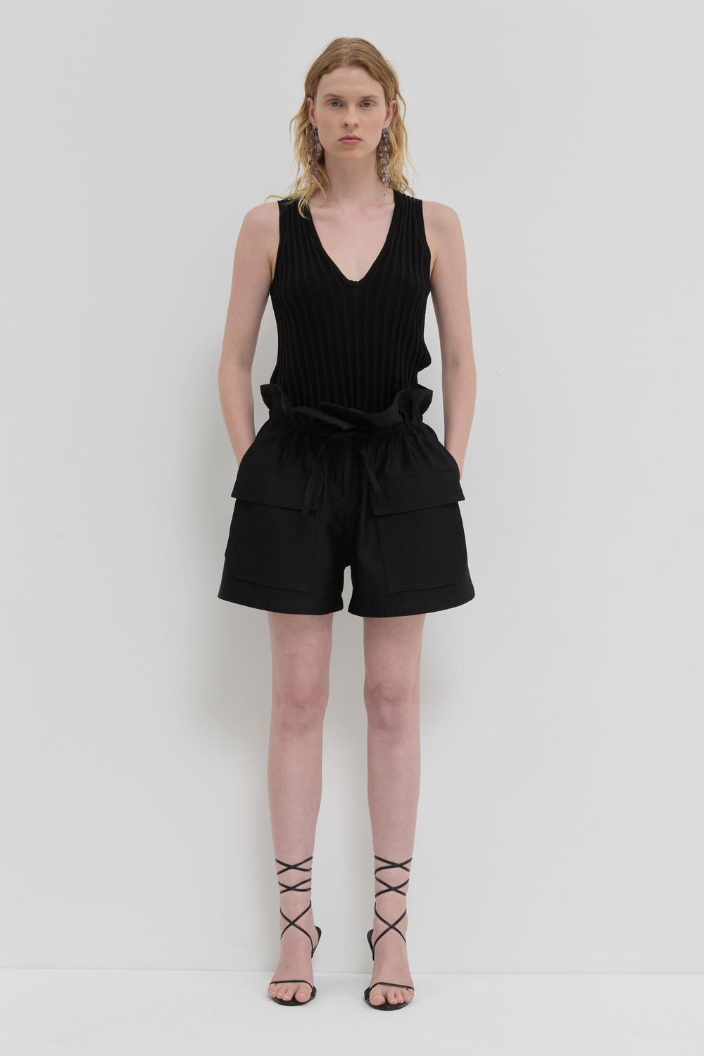 Black quilted belted shorts with folded waistband and topstitching
