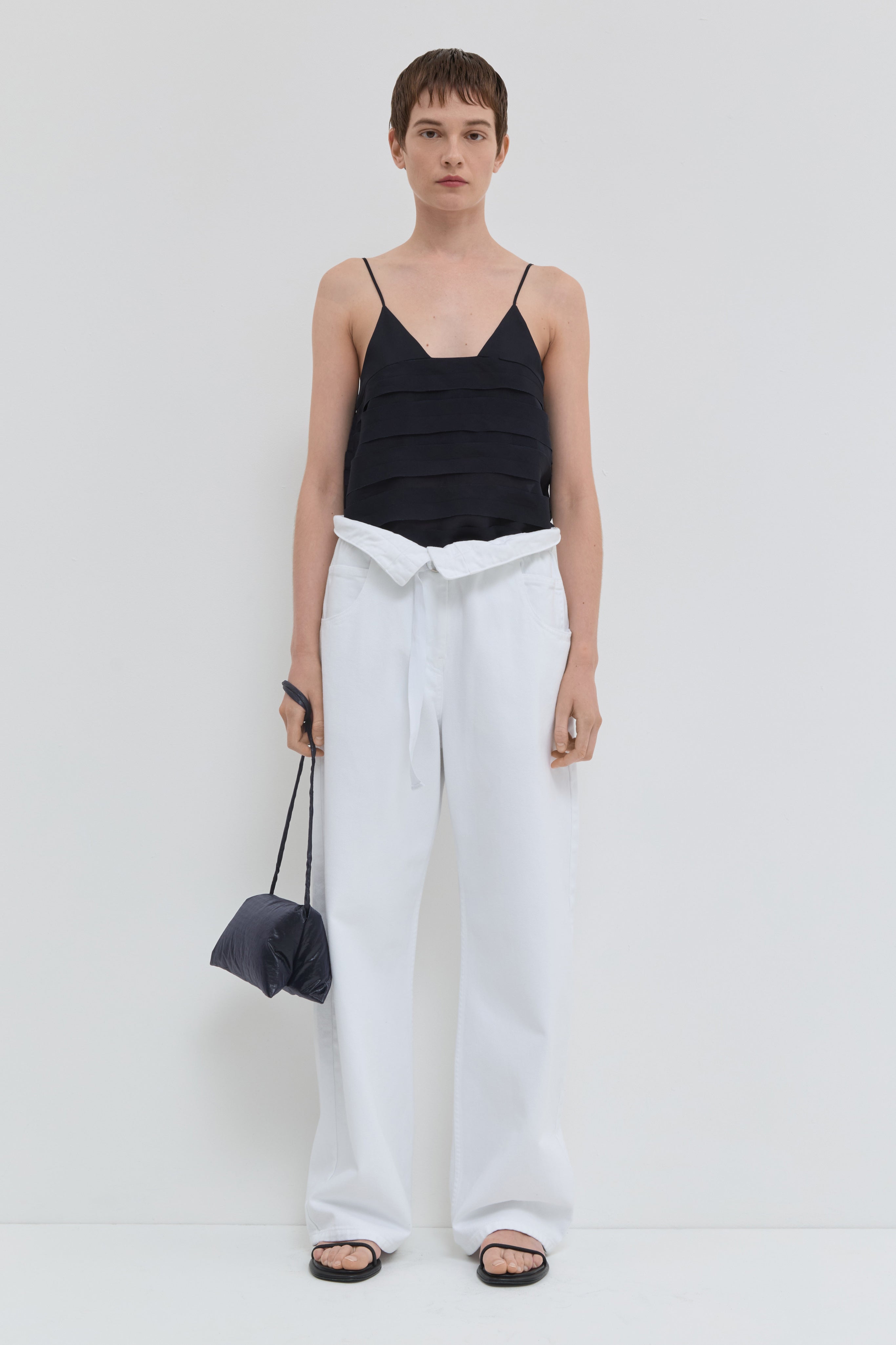 Optical white wide leg jeans with folded waistband and belt detail