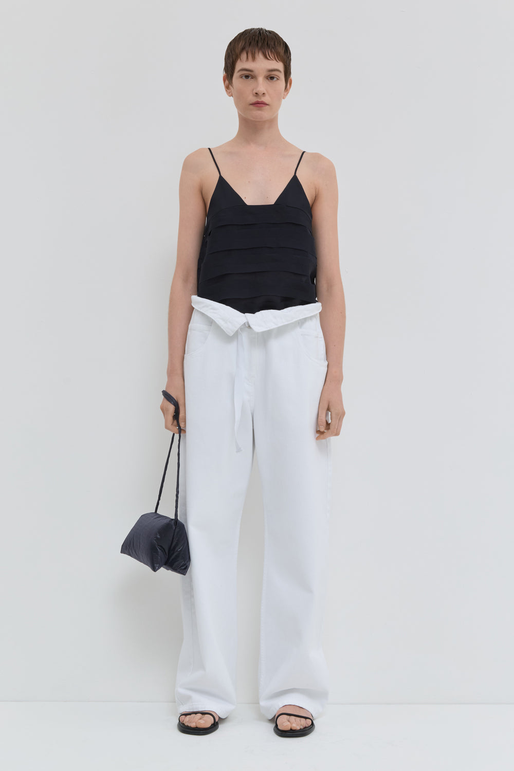 Optical white wide leg jeans with folded waistband and belt detail