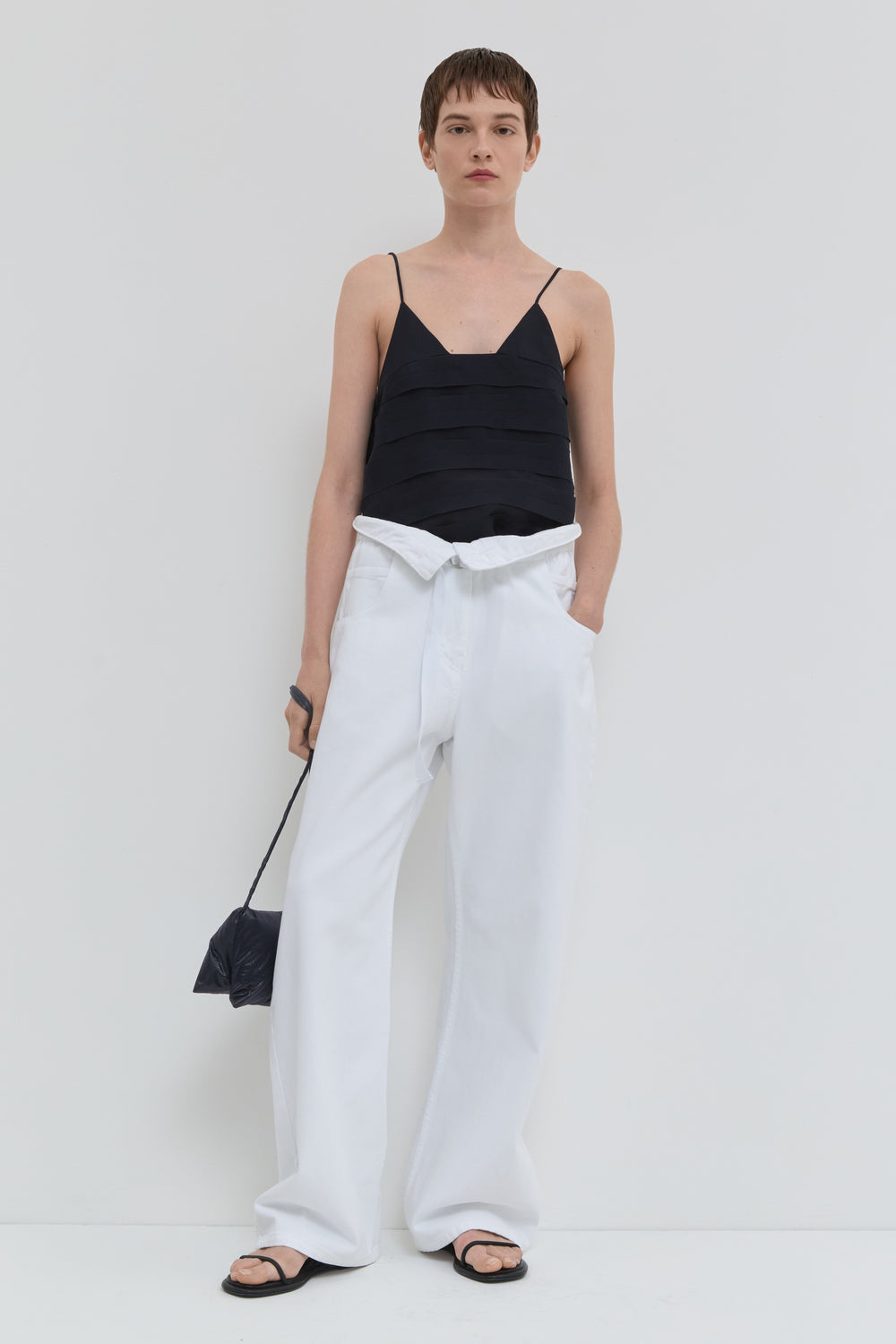 Optical white wide leg jeans with folded waistband and belt detail