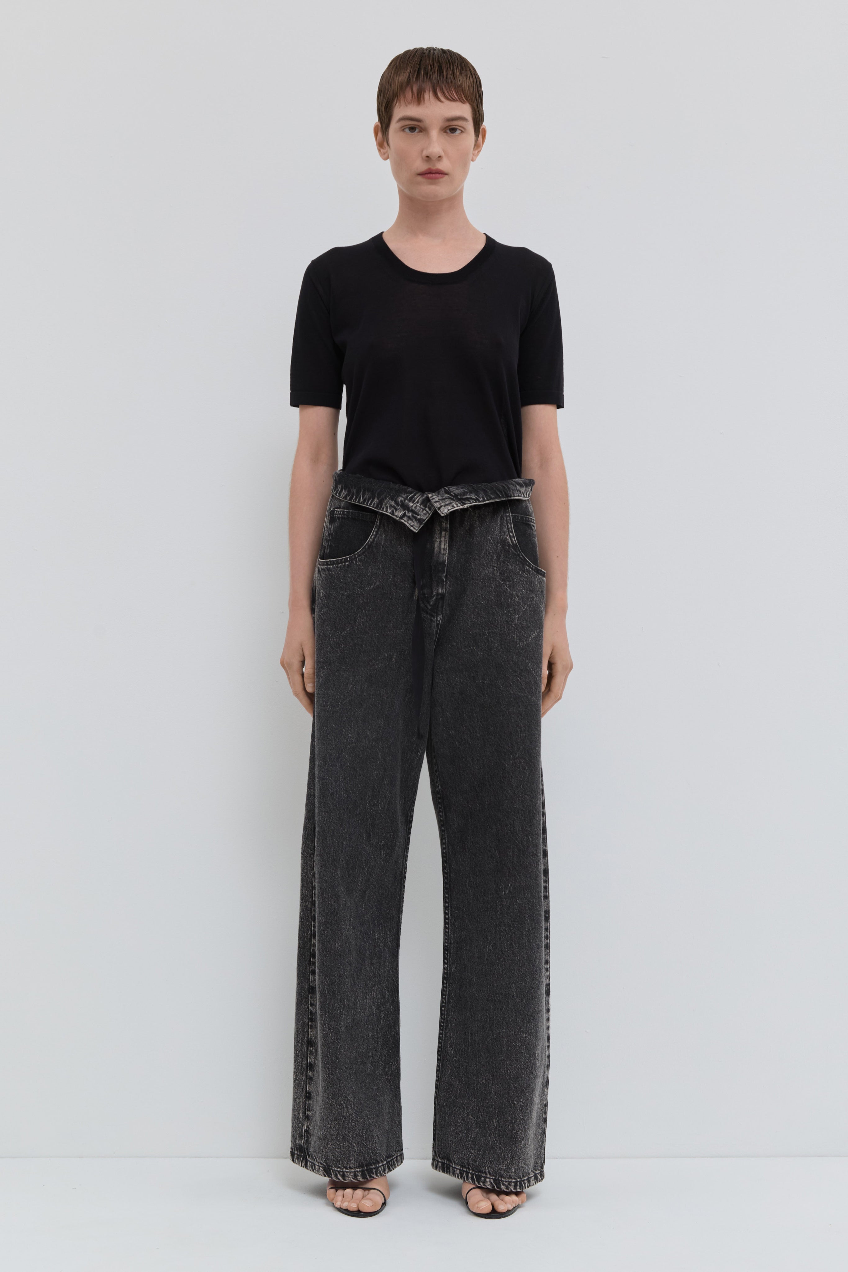Dark denim wide leg jeans with folded waistband and belt detail