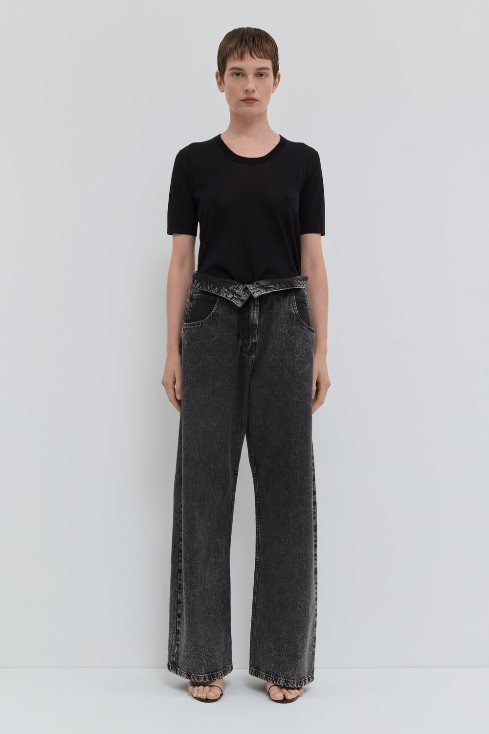 Dark denim wide leg jeans with folded waistband and belt detail