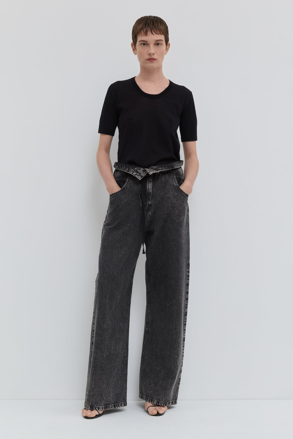 Dark denim wide leg jeans with folded waistband and belt detail