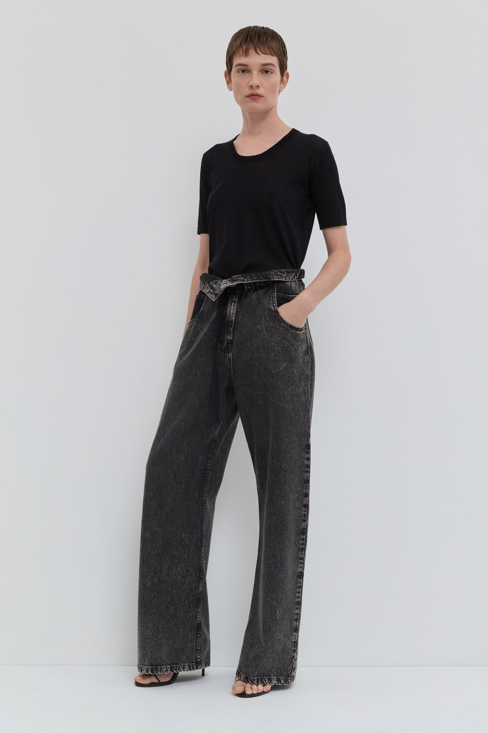 Dark denim wide leg jeans with folded waistband and belt detail