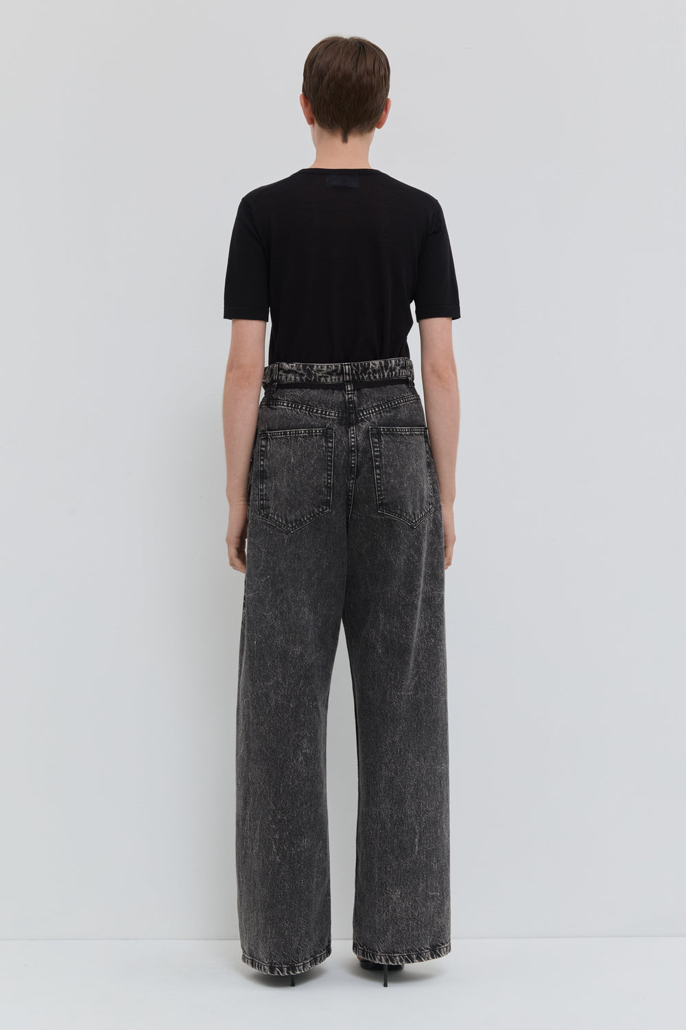 Dark denim wide leg jeans with folded waistband and belt detail