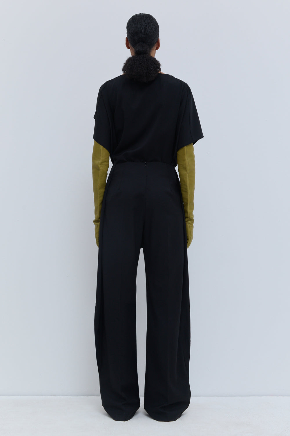 Back view of Christian Wijnants Pilba wide-leg trousers in black 100% virgin wool