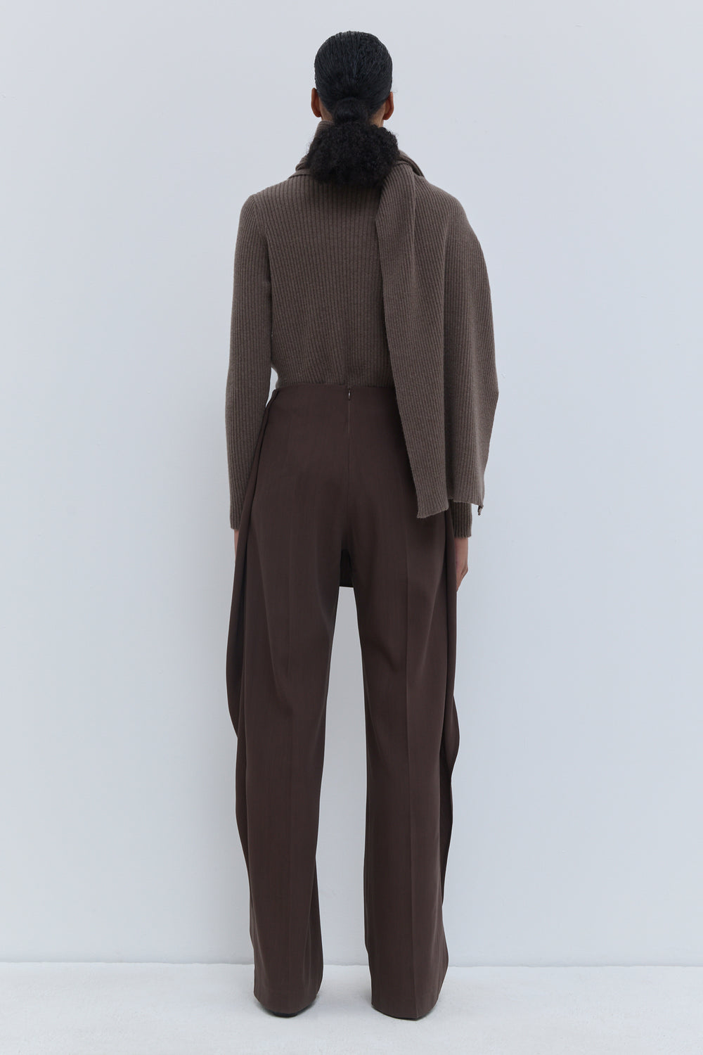 Back view of Christian Wijnants Pilba wide-leg trousers in chestnut 100% virgin wool