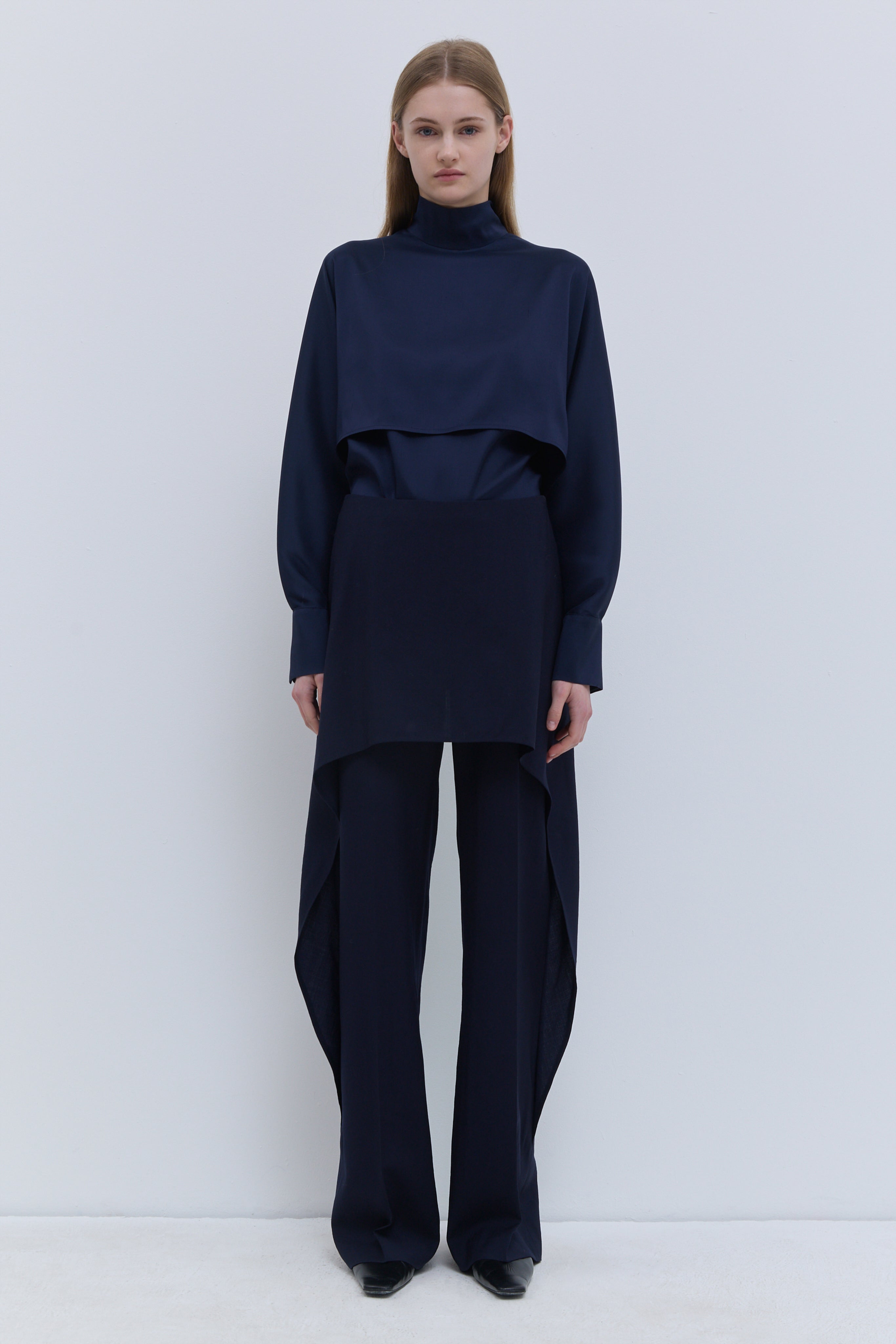 Christian Wijnants Pilba dark navy virgin wool wide-leg trousers with layered skirt overlay, shown from the front