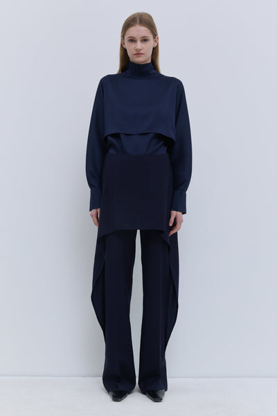 Christian Wijnants Pilba dark navy virgin wool wide-leg trousers with layered skirt overlay, shown from the front