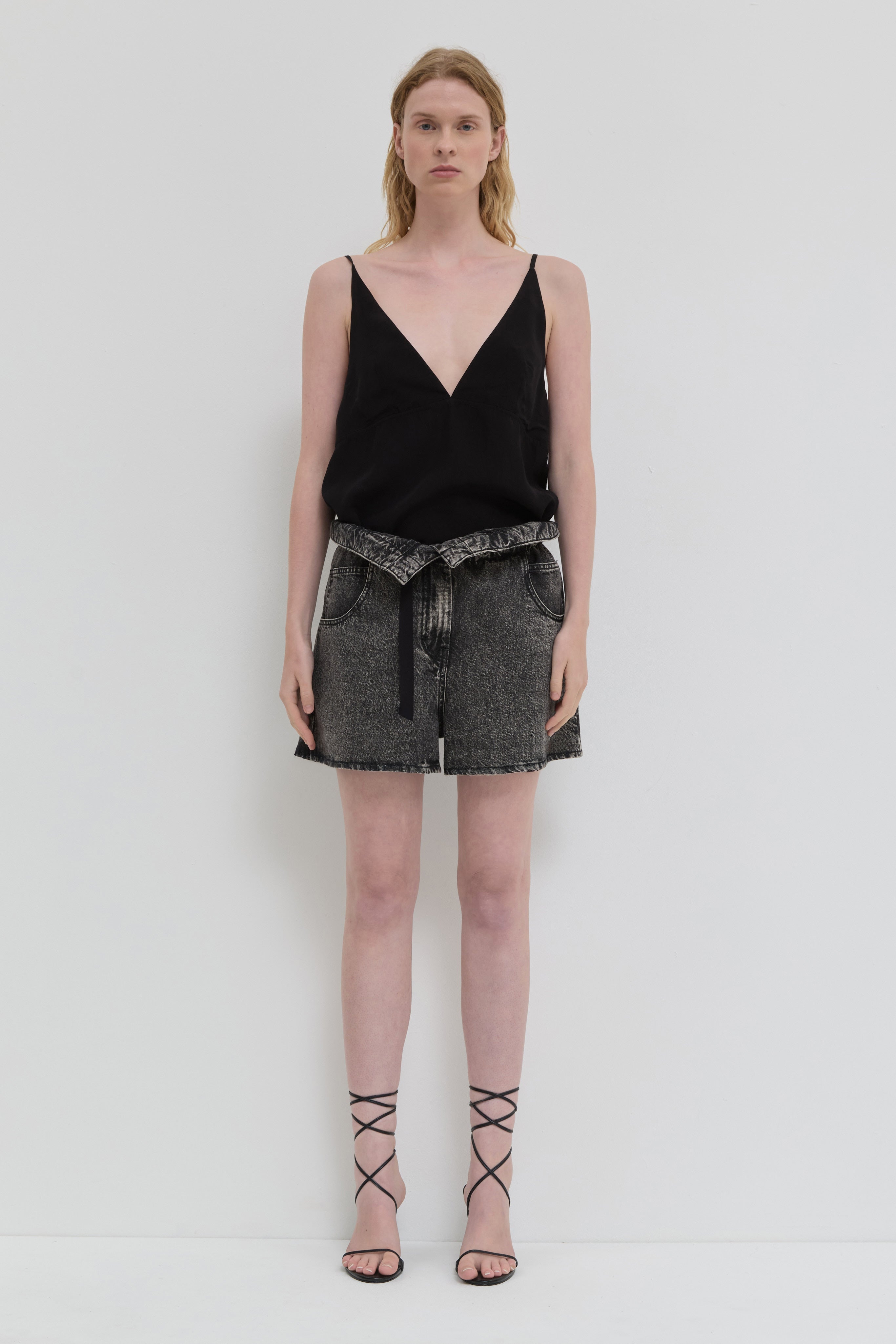 Dark denim shorts with folded waistband and belt detail