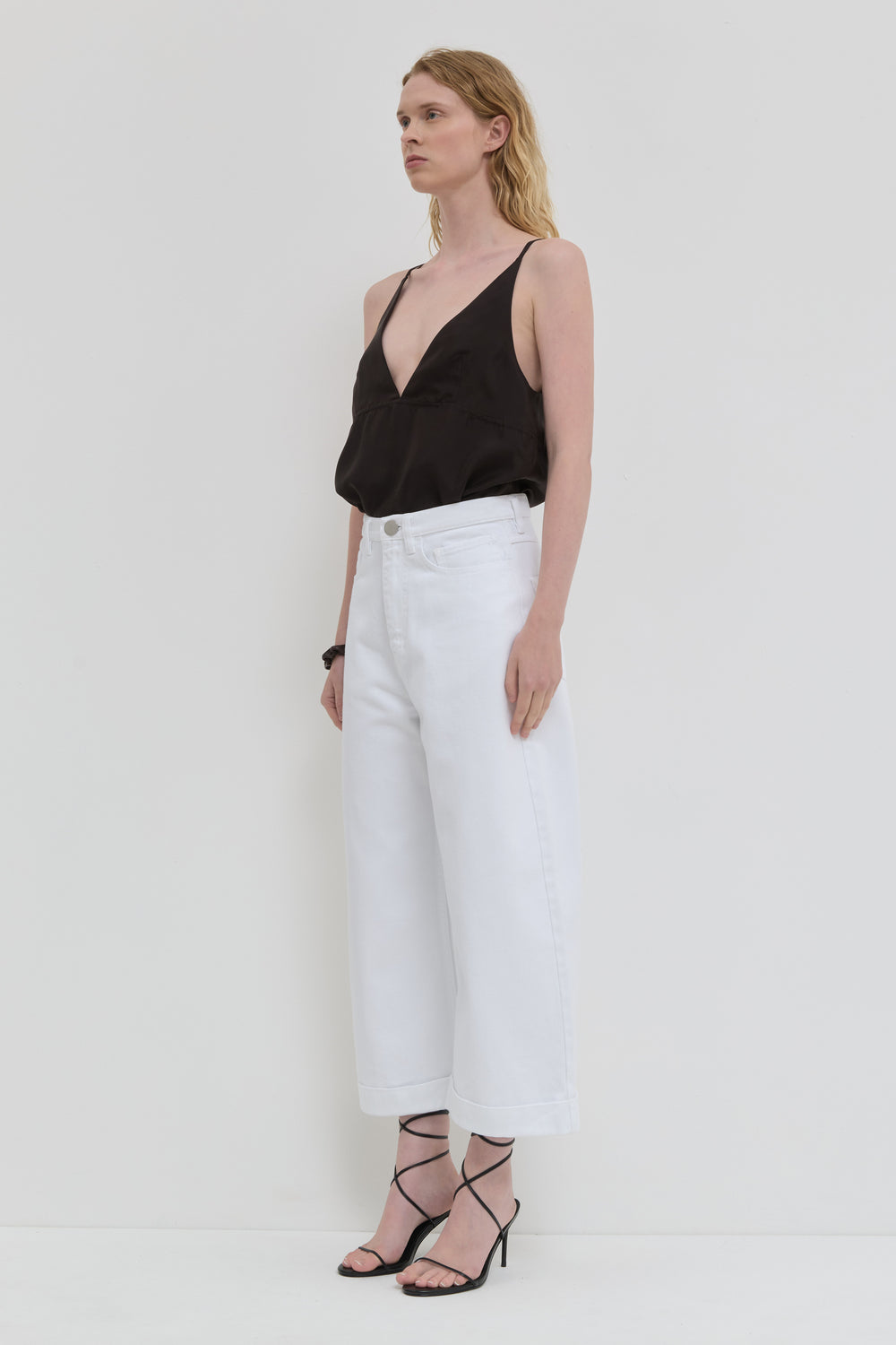 Optical white wide leg cropped jeans with cuff detail side view
