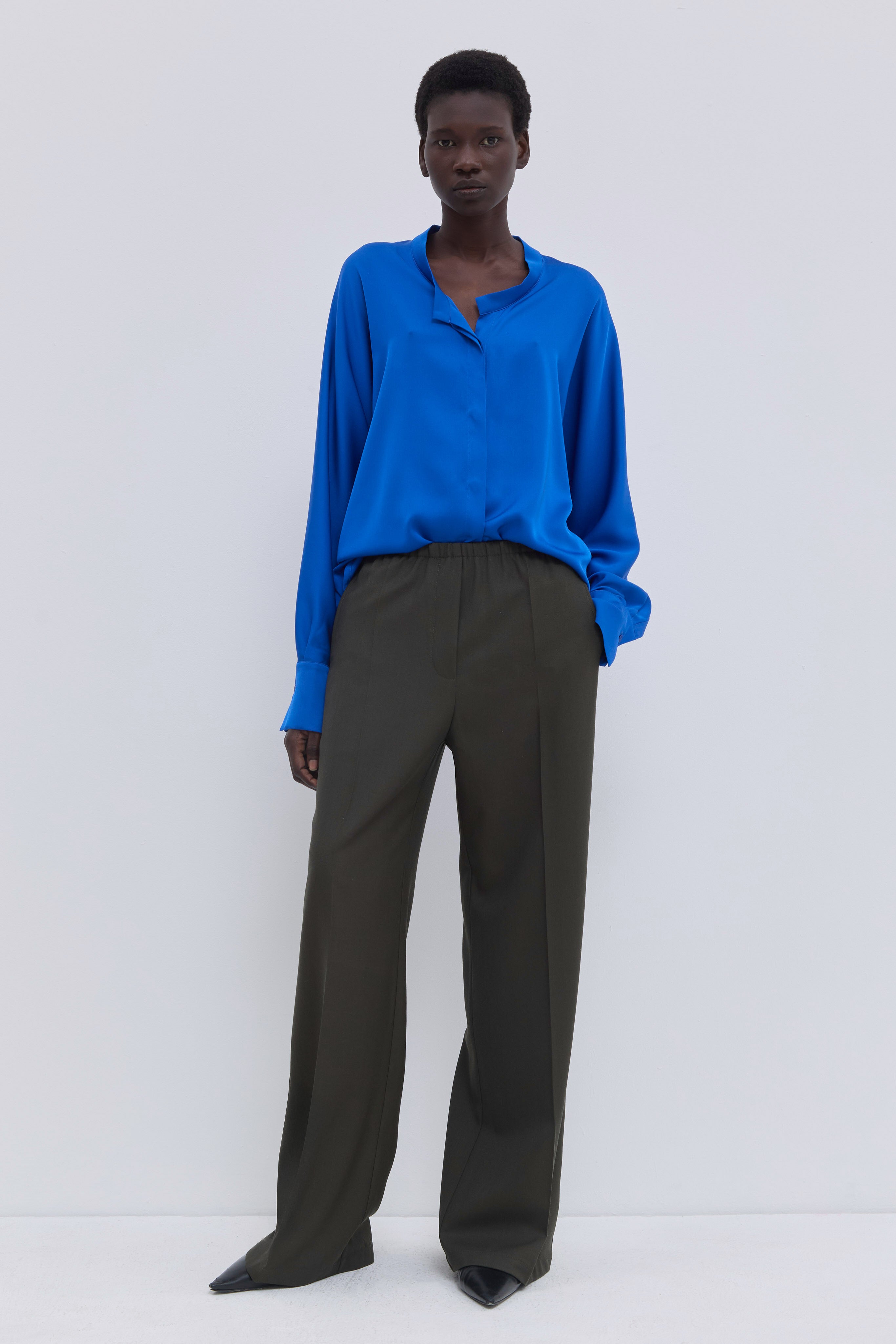 Pune dark forest virgin wool trousers with elasticated waistband.