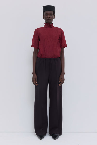 Deep plum low-waist trousers with wide-leg silhouette and elastic waistband