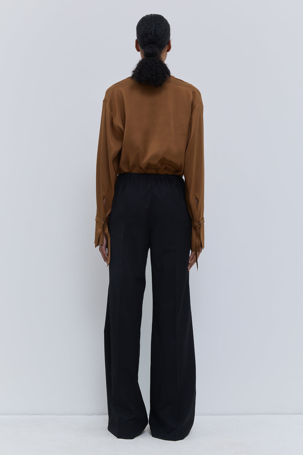 Back view of Christian Wijnants Pune dark navy straight-leg trousers in virgin wool