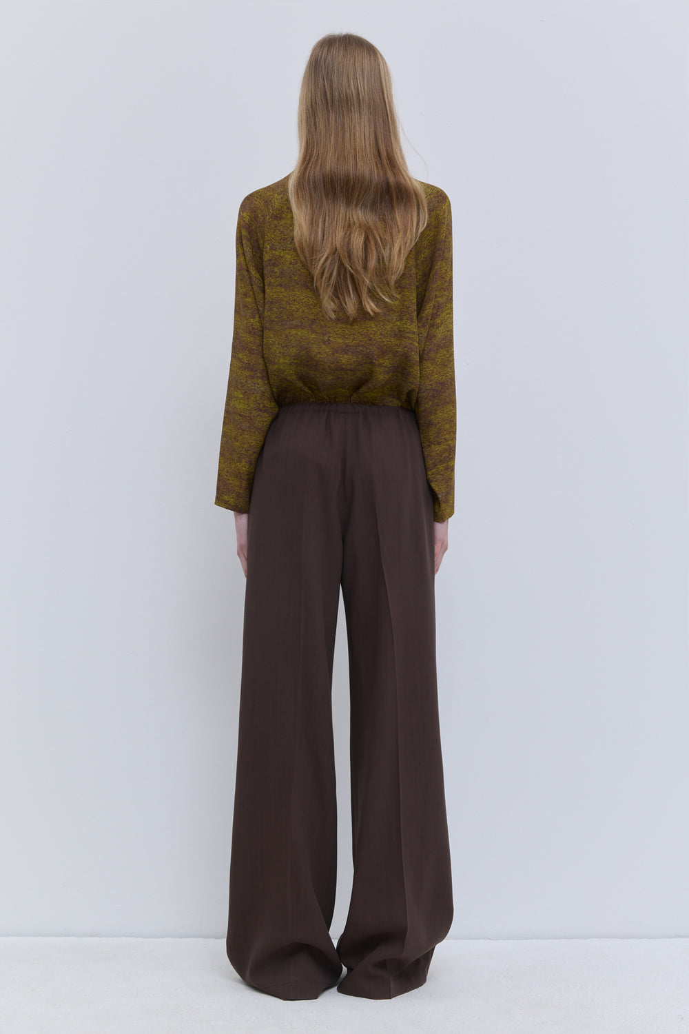Back view of Christian Wijnants Pune chestnut straight-leg trousers in virgin wool